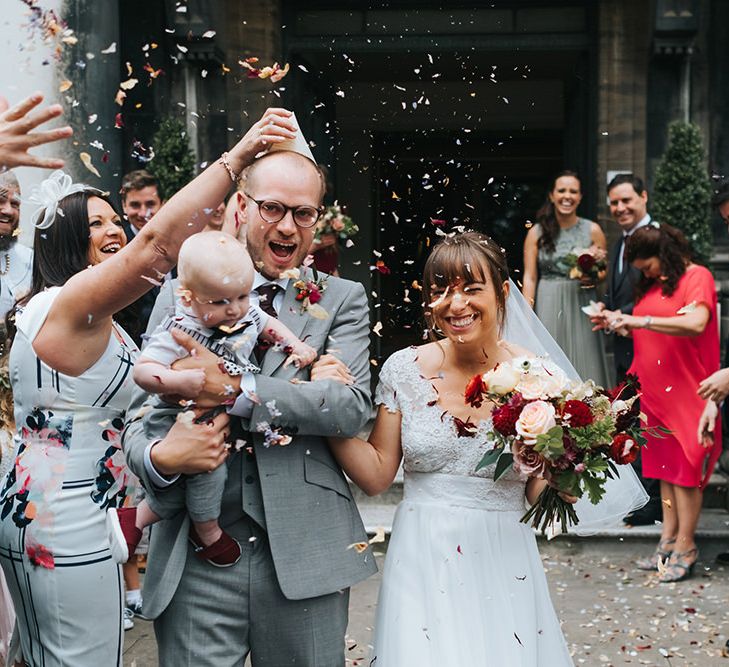 Confetti Moment | Bride in Cymbeline Wedding Dress | Groom in Bailey Nelson Suit | Intimate Ceremony at Stoke Newington Town Hall | Miss Gen Photography