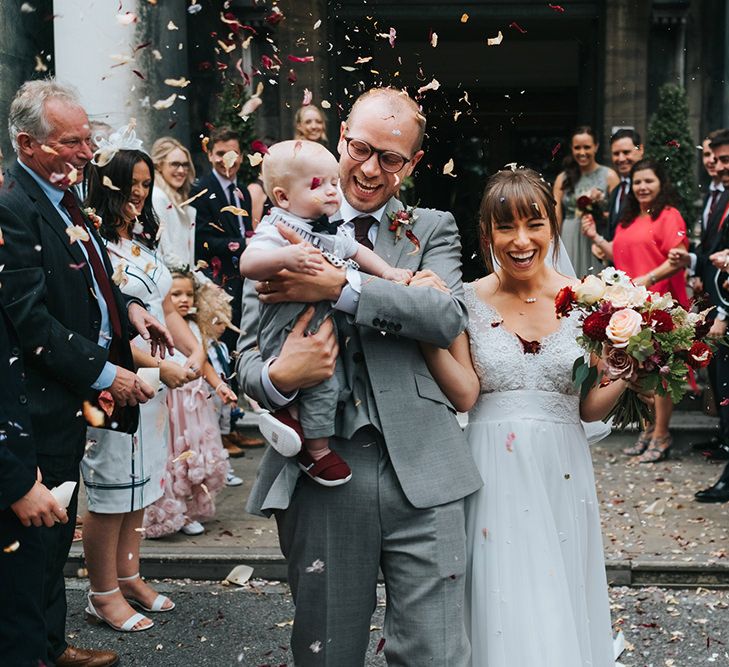 Confetti Moment | Bride in Cymbeline Wedding Dress | Groom in Bailey Nelson Suit | Intimate Ceremony at Stoke Newington Town Hall | Miss Gen Photography