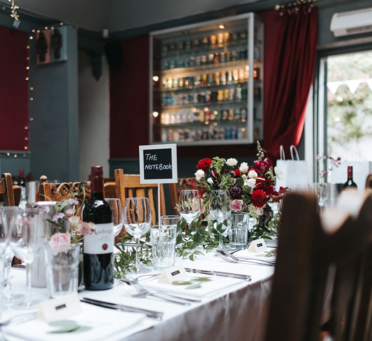 Red & Pink Floral Centrepiece | Laid Back Pub Wedding at The Londesborough | Miss Gen Photography