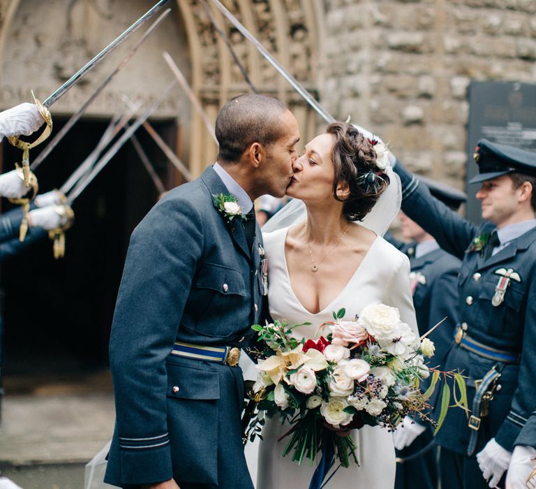 Guard of Honour with Bride in Charlotte Simpson Wedding Dress & Groom in Military Uniform