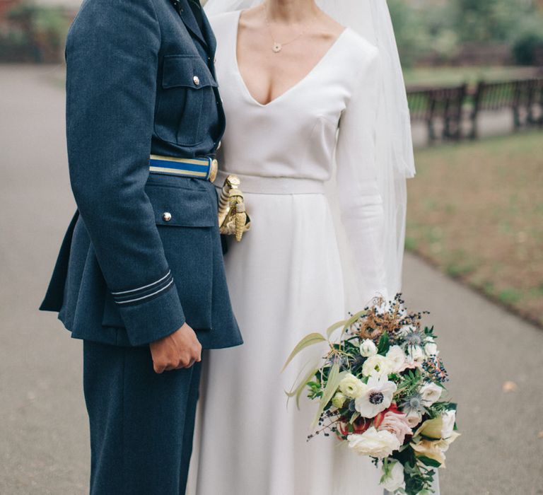 Bride in Charlotte Simpson Wedding Dress & Groom in Military Uniform