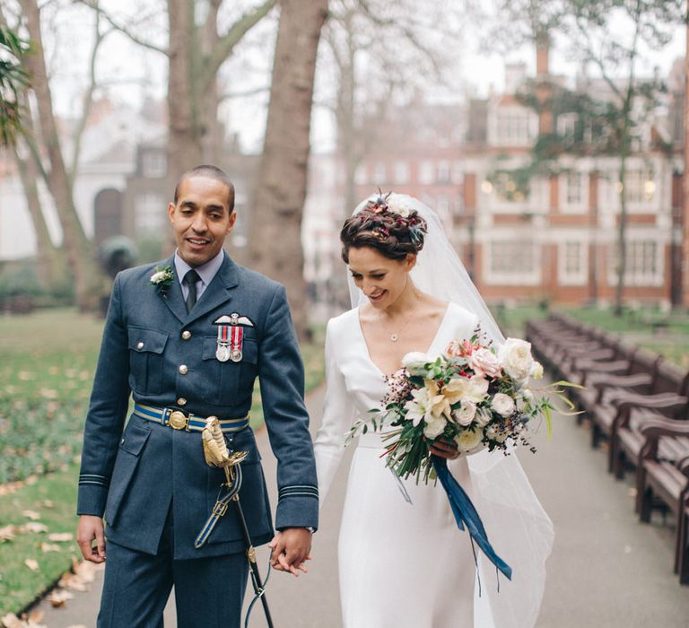 Bride in Charlotte Simpson Wedding Dress & Groom in Military Uniform