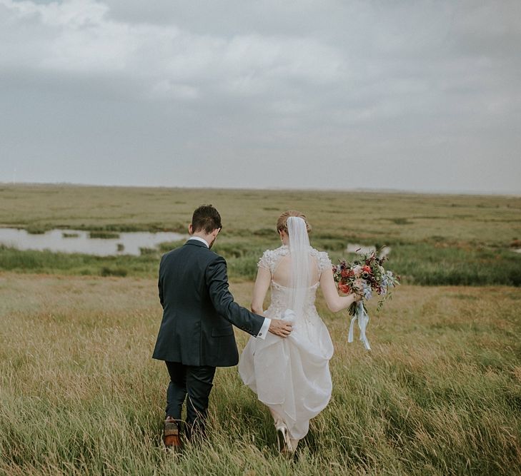 Bride in Alice Temperley Gown | Groom in Edit Suits Co | Lola Rose Photography