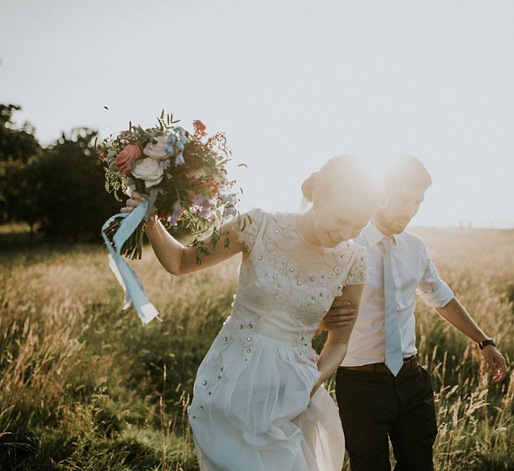 Bride in Alice Temperley Gown | Groom in Edit Suits Co | Lola Rose Photography