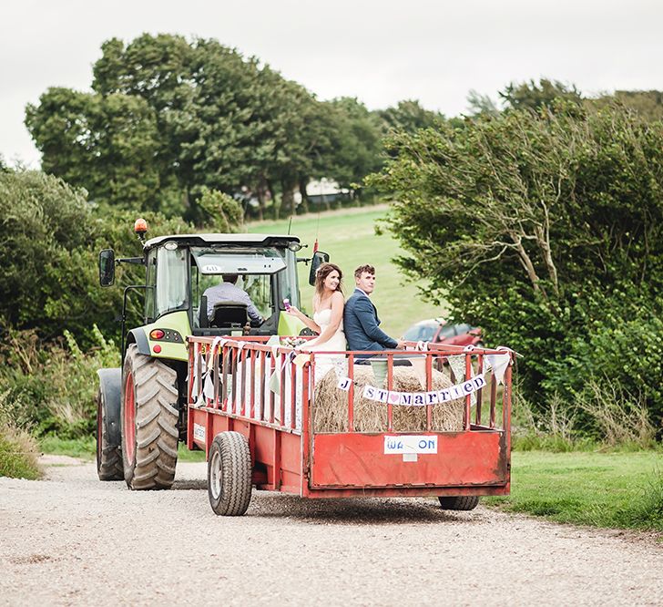 Wedding Transport On Tractor // Rustic Tipi Wedding With Handmade Details At Purbeck Valley Farmhouse With Coastal Tents Tipi And Images From Darima Frampton Photography