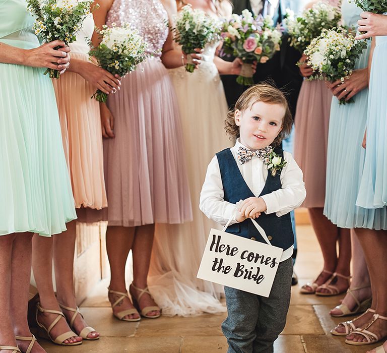 Page Boy With 'Here Comes The Bride' Sign // Rustic Tipi Wedding With Handmade Details At Purbeck Valley Farmhouse With Coastal Tents Tipi And Images From Darima Frampton Photography