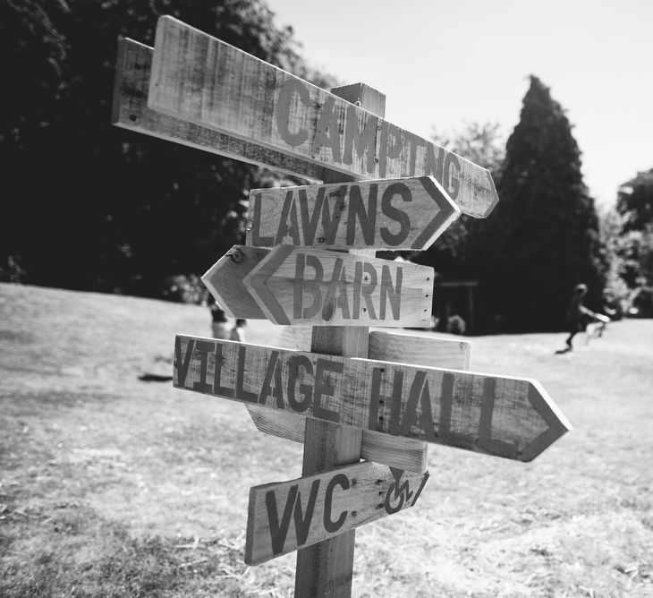 Wooden Picket Fence Direction Sign