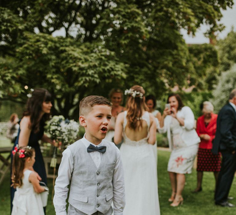 Page Boy in Shorts & Bow Tie | Rustic Tipi Wedding at The Grange, Belluton, Pensford | Images by Felix Russell-Saw & Ryan Winterbotham