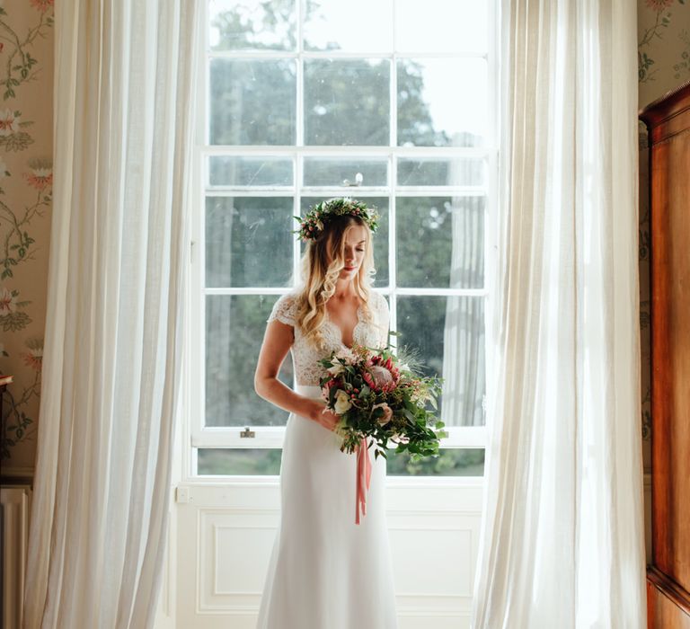 Bride in Bespoke Suzanne Neville Scarlett Bridal Gown | Protea Bouquet & Flower Crown | The Lou's Photography