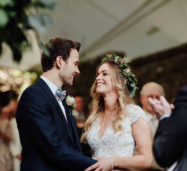 Outdoor Ceremony at Drenagh Estate in Northern Ireland | Bride in Bespoke Suzanne Neville Scarlett Bridal Gown | Protea Bouquet & Flower Crown | The Lou's Photography