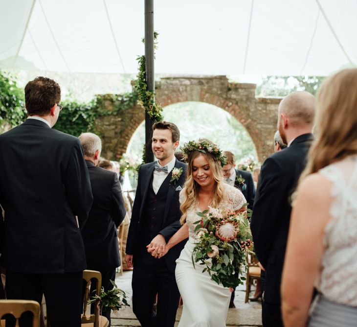 Outdoor Ceremony at Drenagh Estate in Northern Ireland | Bride in Bespoke Suzanne Neville Scarlett Bridal Gown | Protea Bouquet & Flower Crown | The Lou's Photography