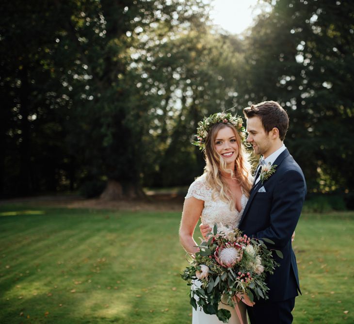 Bride in Bespoke Suzanne Neville Scarlett Bridal Gown | Groom in Herbie Frogg Suit & Liberty Print Mrs Bow Tie | The Lou's Photography