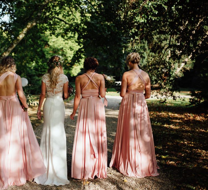 Bride in Bespoke Suzanne Neville Scarlett Bridal Gown | Bridesmaids in Blush Pink Multiway Twobirds Dresses | The Lou's Photography