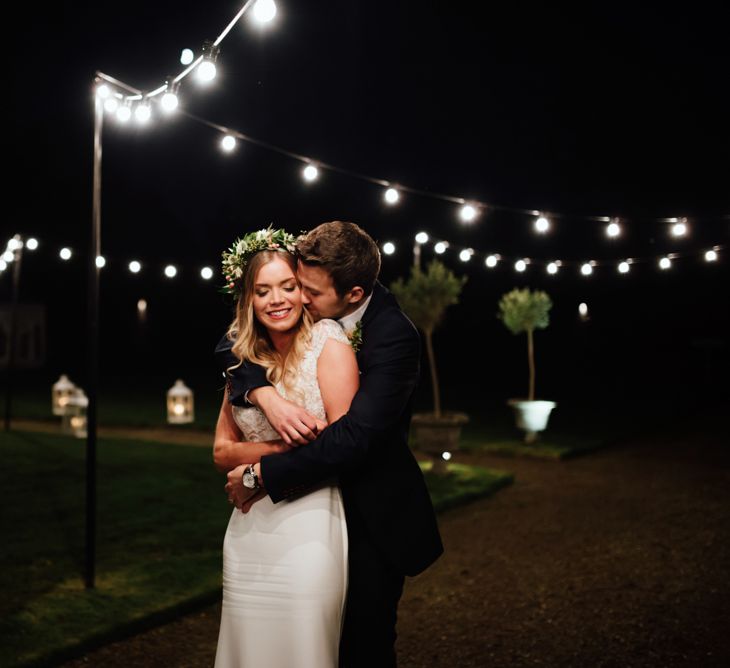 Festoon Lights | Bride in Bespoke Suzanne Neville Scarlett Bridal Gown | Groom in Herbie Frogg Suit & Liberty Print Mrs Bow Tie | The Lou's Photography