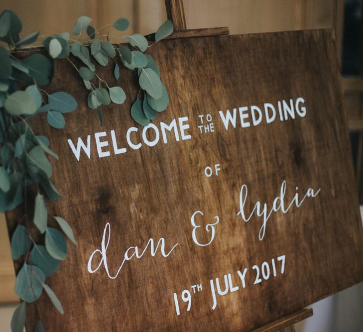 Wooden Welcome Sign with Greenery | Country Wedding at Farmers Barns, Rosedew Farm, Cardiff | Grace Elizabeth Photography and Film