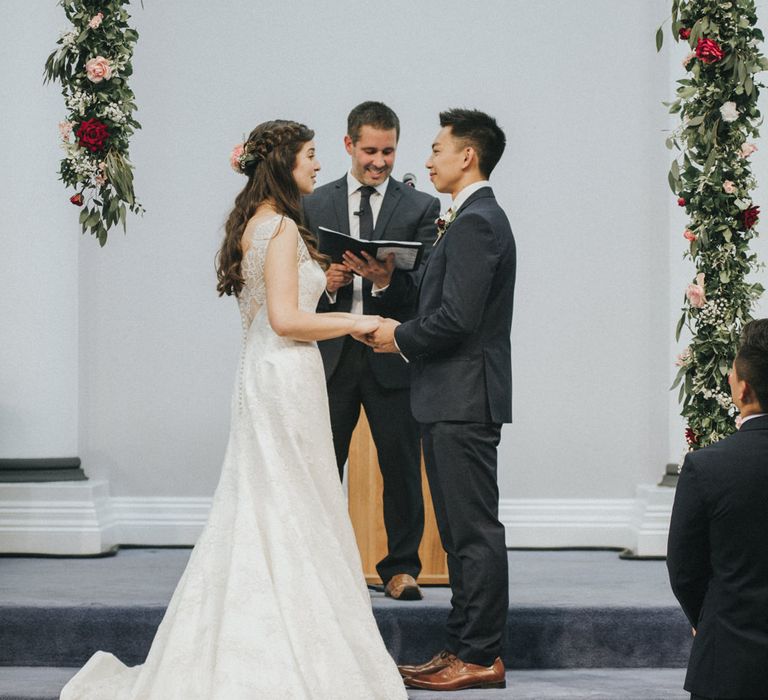 Wedding Ceremony | Floral Garland Altar | Bride in Augusta Jones Sophia Gown | Groom in Slaters Suit | Country Wedding at Farmers Barns, Rosedew Farm, Cardiff | Grace Elizabeth Photography and Film