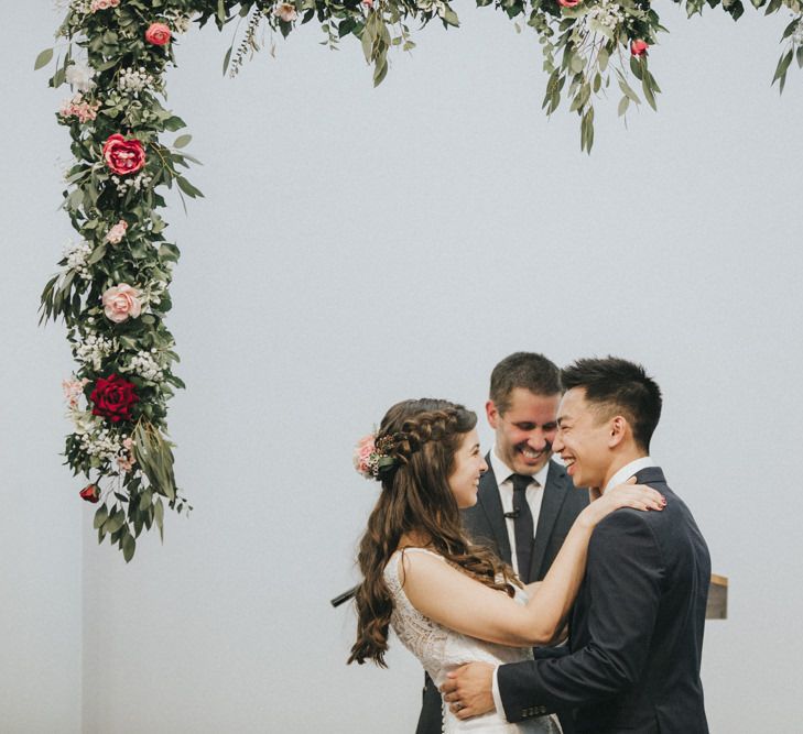 Wedding Ceremony | Floral Garland Altar | Bride in Augusta Jones Sophia Gown | Groom in Slaters Suit | Country Wedding at Farmers Barns, Rosedew Farm, Cardiff | Grace Elizabeth Photography and Film