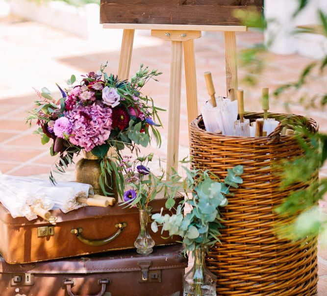 Wooden Wedding Welcome Sign with Vintage Suitcases & Parasols | Jewel Coloured Spanish Wedding Planned & Styled by Rachel Rose Weddings | Anna Gazda Photography