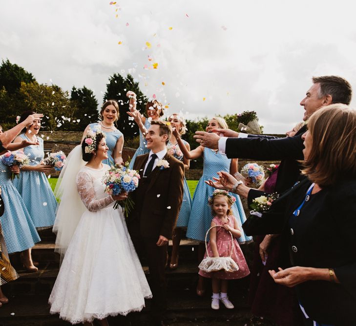 Confetti | Wedding Ceremony | Bride in Bespoke Something Blue Tea Length Wedding Dress | Pastel Flower Crown & Bouquet | Ally M Photography