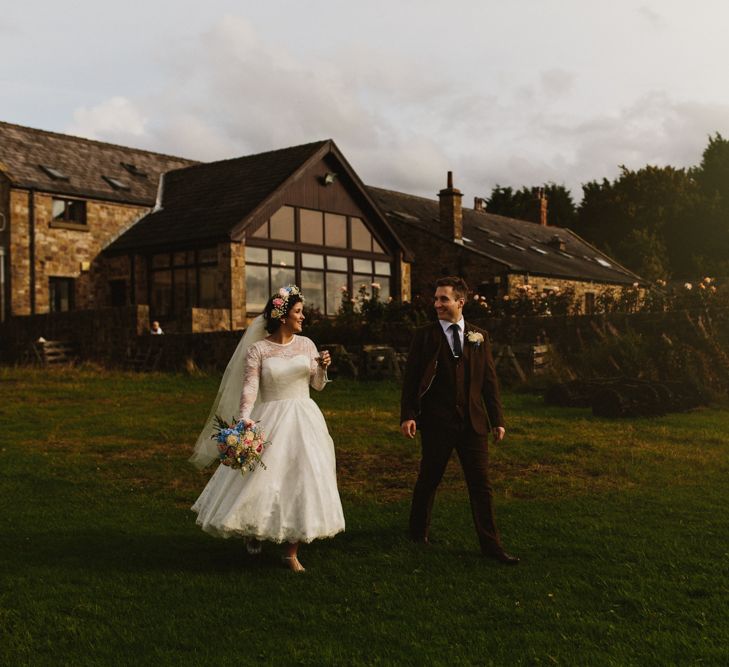 Bride in Bespoke Something Blue Tea Length Wedding Dress | Pastel Flower Crown & Bouquet | Groom in Brown Tweet Suit | Ally M Photography