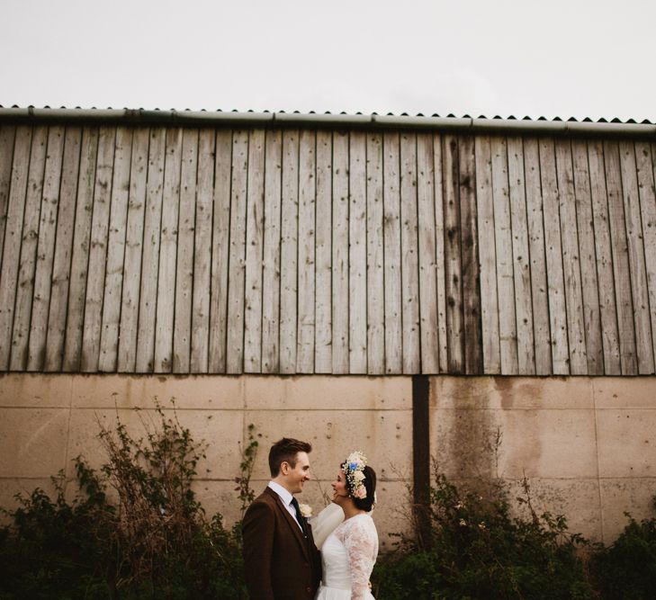 Bride in Bespoke Something Blue Tea Length Wedding Dress | Pastel Flower Crown & Bouquet | Groom in Brown Tweet Suit | Ally M Photography