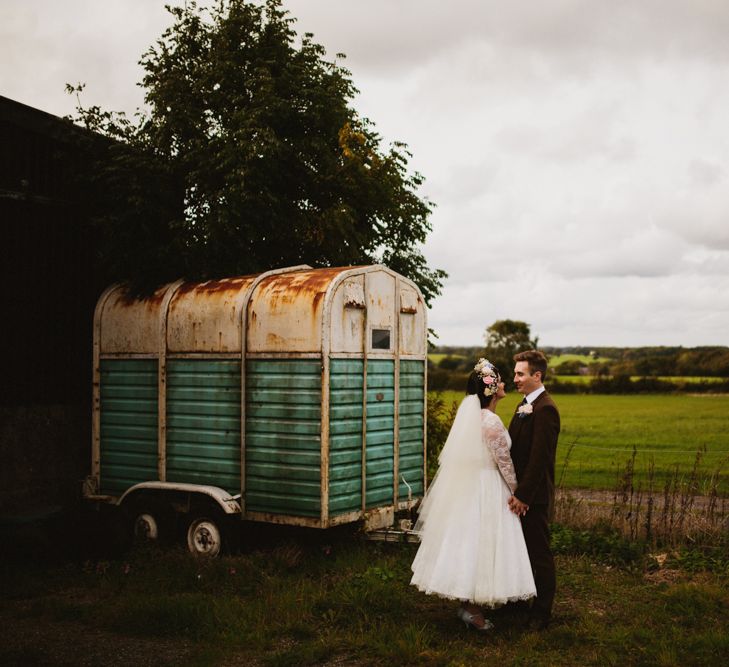 Bride in Bespoke Something Blue Tea Length Wedding Dress | Pastel Flower Crown & Bouquet | Groom in Brown Tweet Suit | Ally M Photography