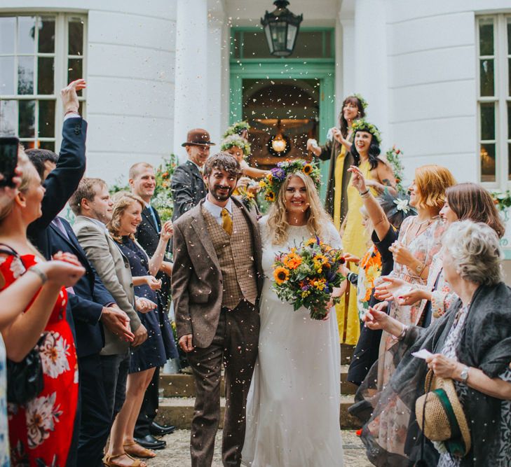 Confetti Exit | Bride in ASOS Wedding Dress | Groom in Tweed Suit | Bright DIY Back Garden Wedding | Lisa Webb Photography | Bright DIY Back Garden Wedding | Lisa Webb Photography