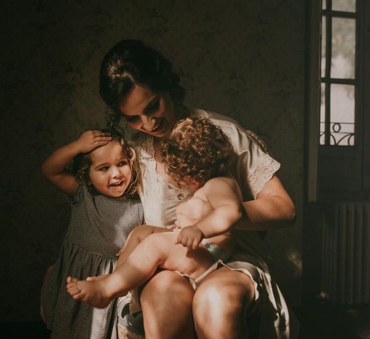 Bride With Daughters On Wedding Day