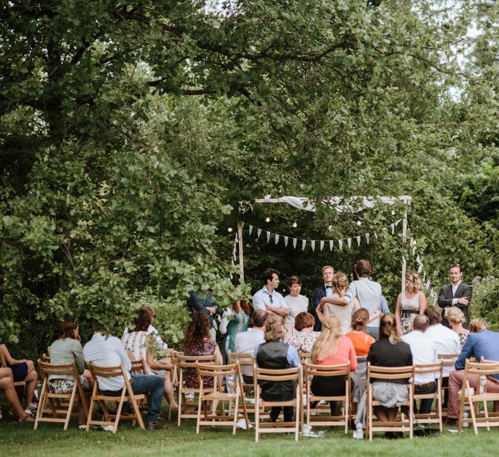 Outdoor Wedding Ceremony With Bunting & Festoon Lights