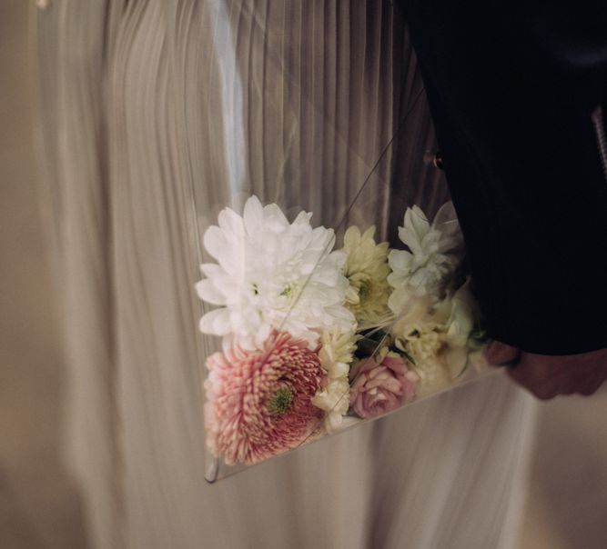 Perspex Pouch With Flowers In Lieu Of Bouquet // Rime Arodaky Bride For A Stylish Artistic & Bohemian French Wedding At La Dime De Giverny France With Images From Paris Wedding Photographer Juli Etta