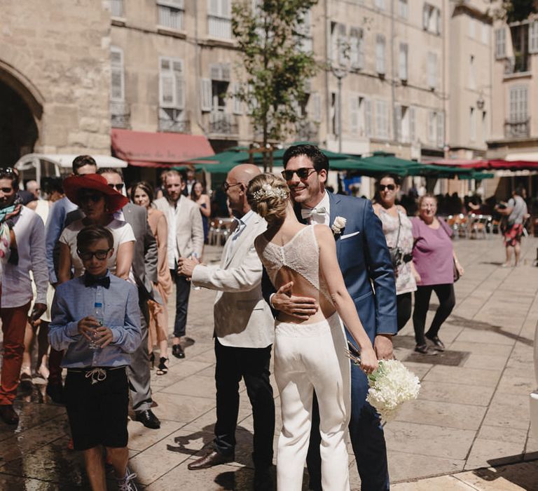 Bride in Nicolas Fafiotte Jumpsuit & Groom in Faubourg Saint-Sulpice Suit | Sebastien Boudot Photography