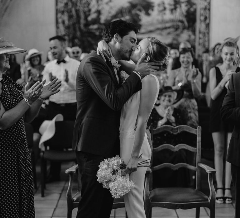 Bride in Nicolas Fafiotte Jumpsuit & Groom in Faubourg Saint-Sulpice Suit | Sebastien Boudot Photography