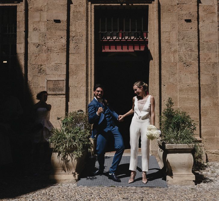 Bride in Nicolas Fafiotte Jumpsuit & Groom in Faubourg Saint-Sulpice Suit | Sebastien Boudot Photography