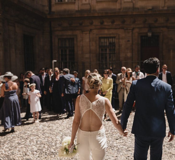 Bride in Nicolas Fafiotte Jumpsuit & Groom in Faubourg Saint-Sulpice Suit | Sebastien Boudot Photography