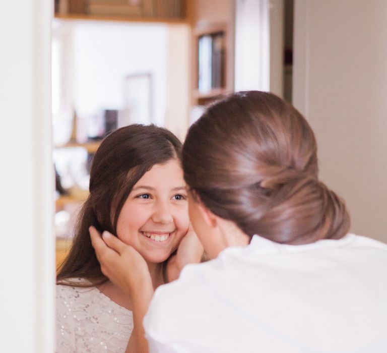 Bride Getting Ready with Flower Girl