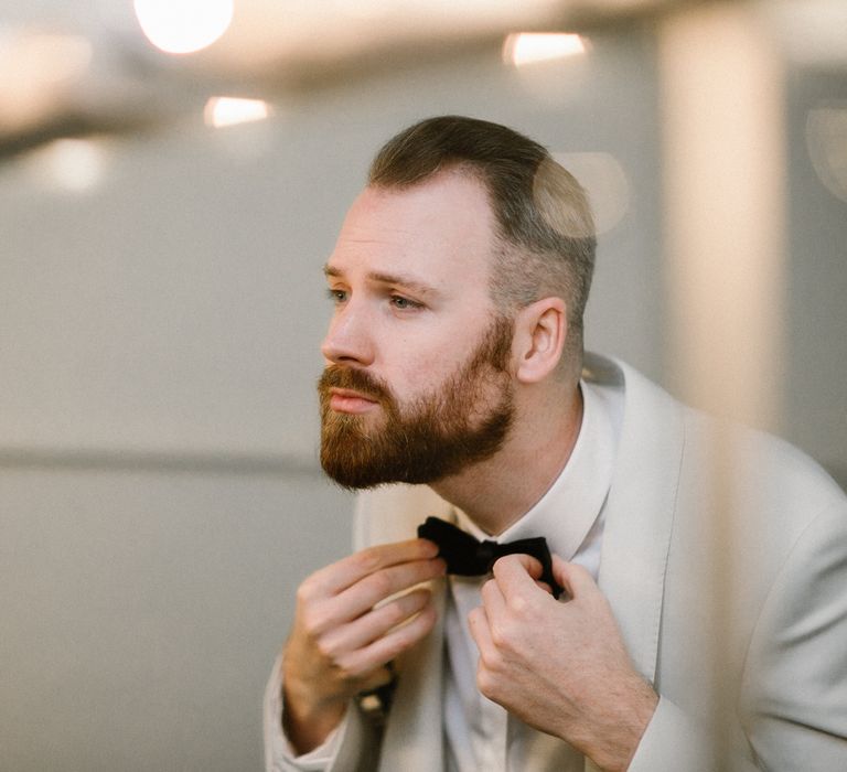 Groom in White Tuxedo