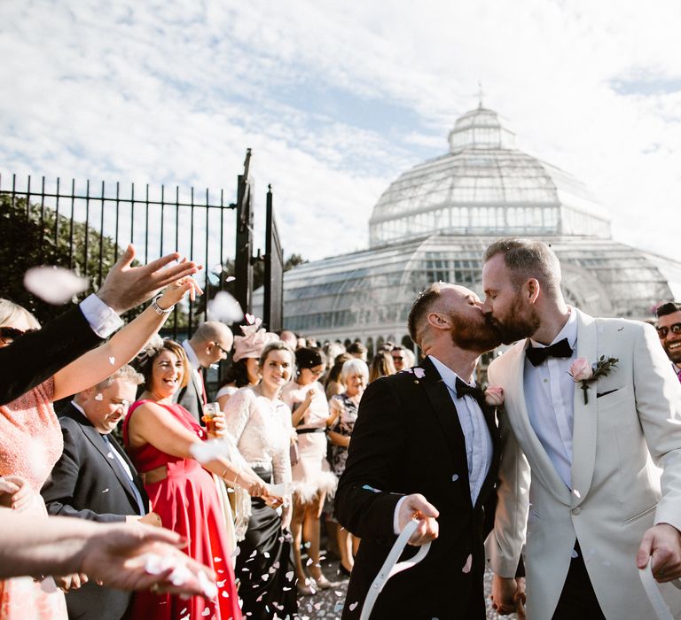 Groom & Groom in Tuxedos outside Sefton Park Palm House in Liverpool