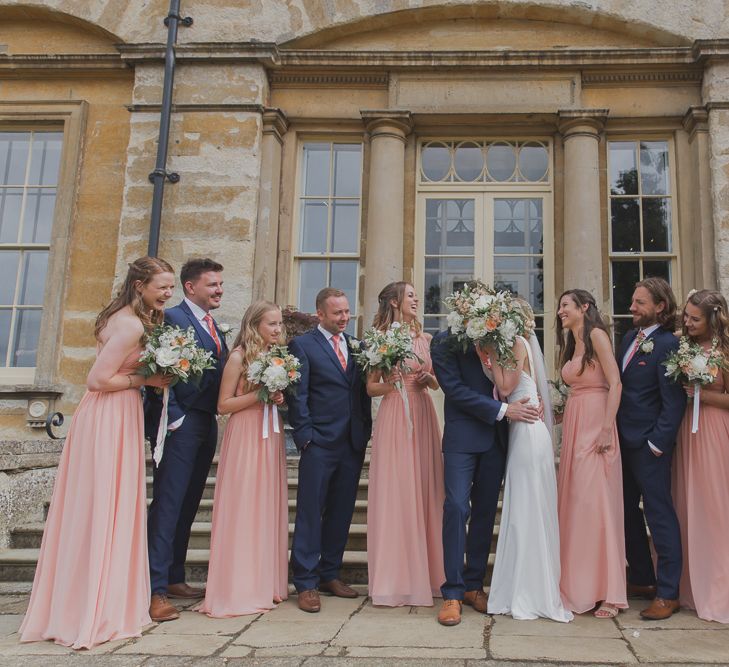 Wedding Party | Bride in Justin Alexander Gown | Groom in Moss Bros Suit | Outdoor Peach Wedding at Courteenhall House in Northamptonshire Planned by Your Story Events | Ferri Photography