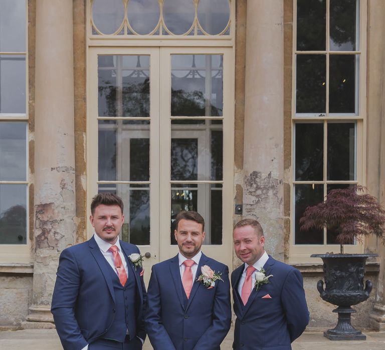 Groomsmen in Moss Bros Suits | Outdoor Peach Wedding at Courteenhall House in Northamptonshire Planned by Your Story Events | Ferri Photography