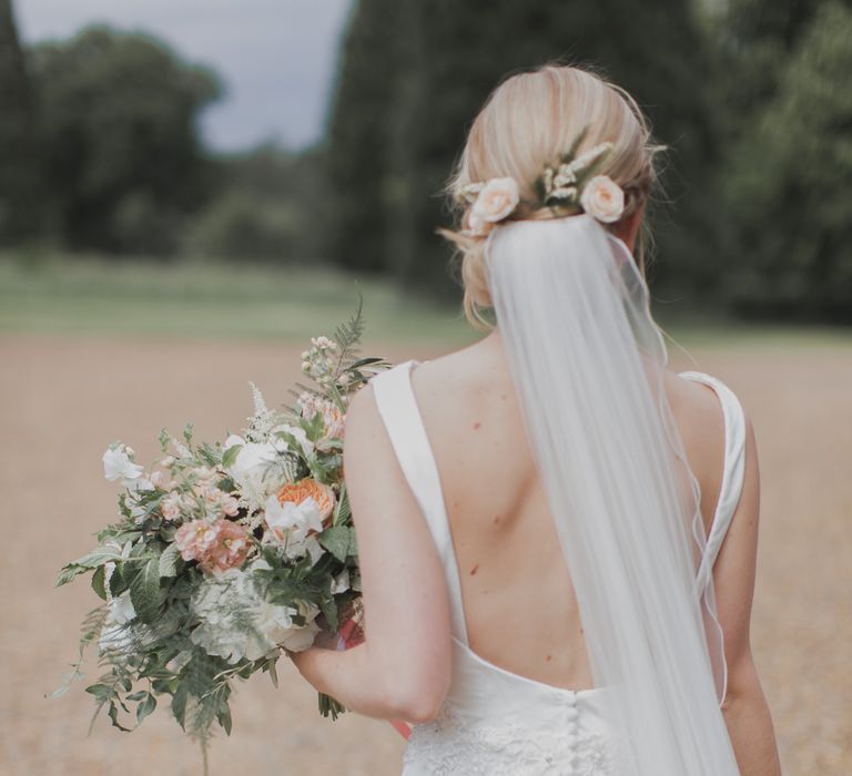 Bride in Justin Alexander Gown | Outdoor Peach Wedding at Courteenhall House in Northamptonshire Planned by Your Story Events | Ferri Photography