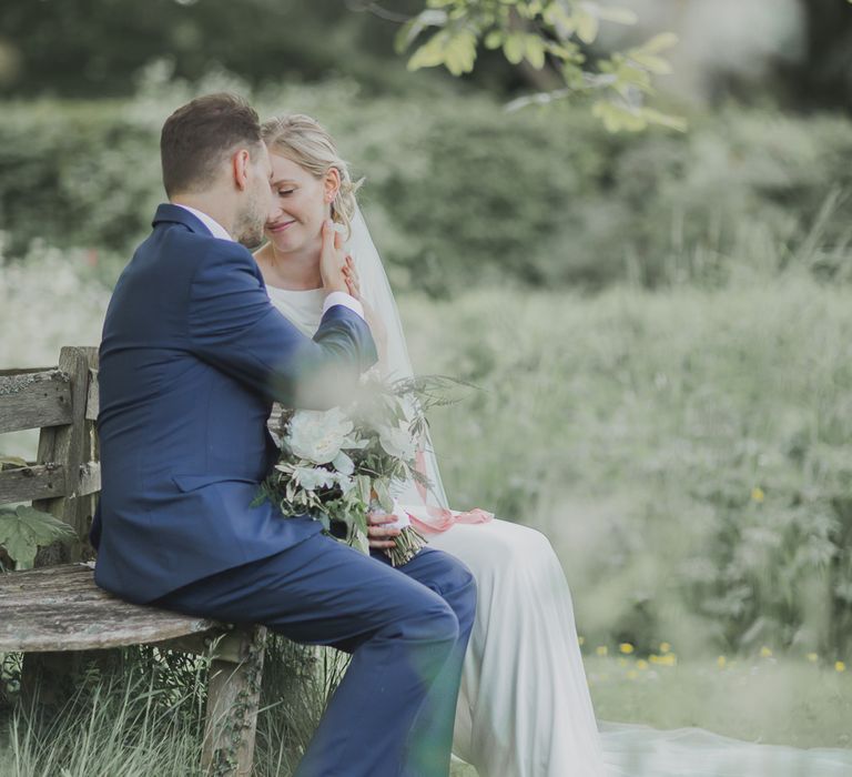 Bride in Justin Alexander Gown | Groom in Moss Bros Suit | Outdoor Peach Wedding at Courteenhall House in Northamptonshire Planned by Your Story Events | Ferri Photography