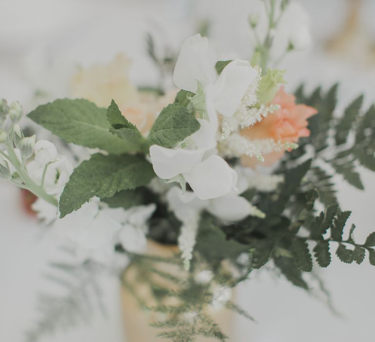 Flower Filled Votives | Outdoor Peach Wedding at Courteenhall House in Northamptonshire Planned by Your Story Events | Ferri Photography