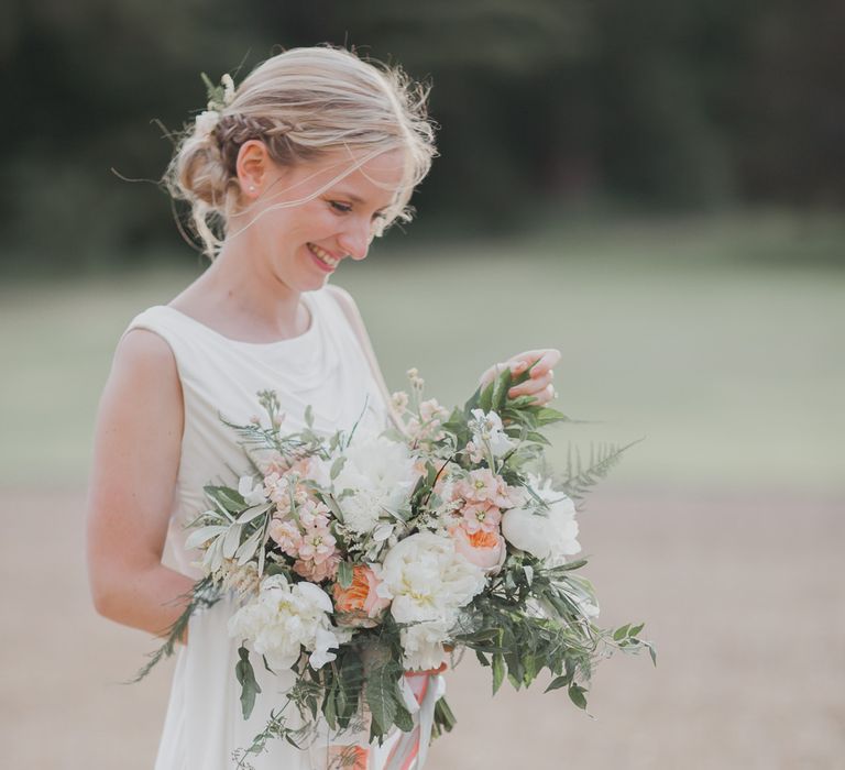 Bride in Justin Alexander Gown | Outdoor Peach Wedding at Courteenhall House in Northamptonshire Planned by Your Story Events | Ferri Photography