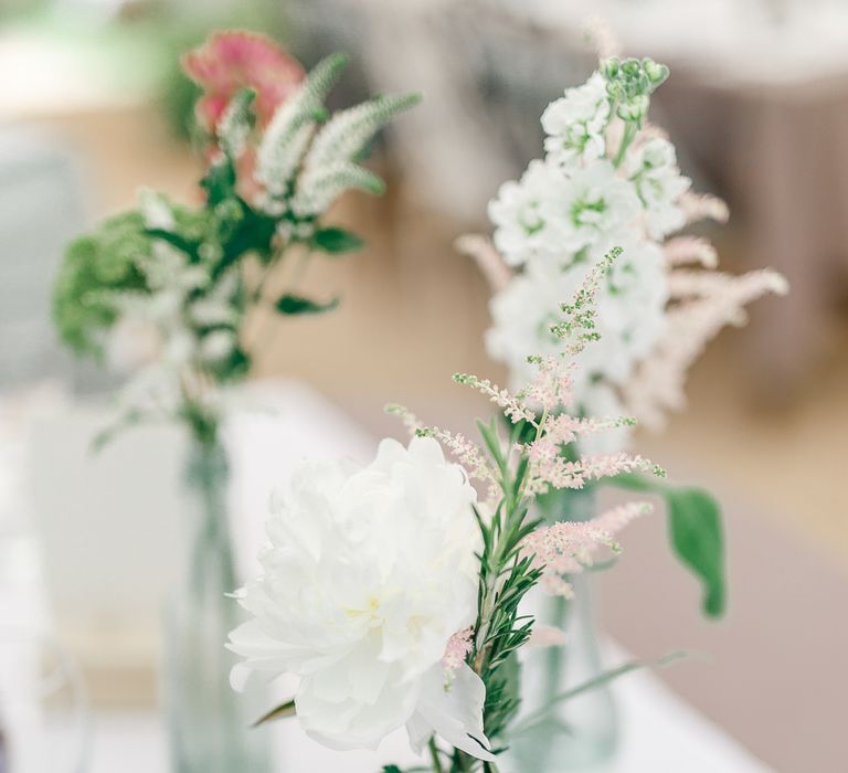 Flower Stems in Bottles | Secret Garden Reception at Castle Cottage Cafe, Oakham | White Stag Wedding Photography