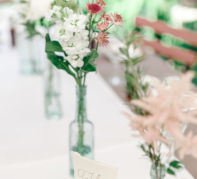 Flower Stems in Bottles | Secret Garden Reception at Castle Cottage Cafe, Oakham | White Stag Wedding Photography