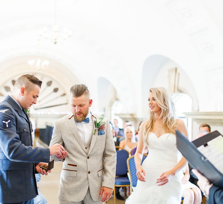 Wedding Ceremony at Normanton Church on Rutland Water | Pronovias Wedding Dress | Groom in Cream Herringbone Tweed Suit from Marc Darcy | White Stag Wedding Photography