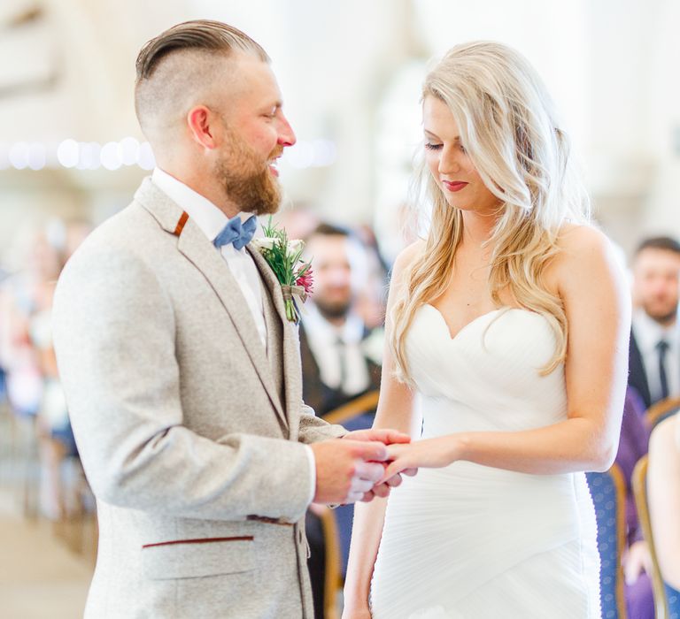 Wedding Ceremony at Normanton Church on Rutland Water | Pronovias Wedding Dress | Groom in Cream Herringbone Tweed Suit from Marc Darcy | White Stag Wedding Photography