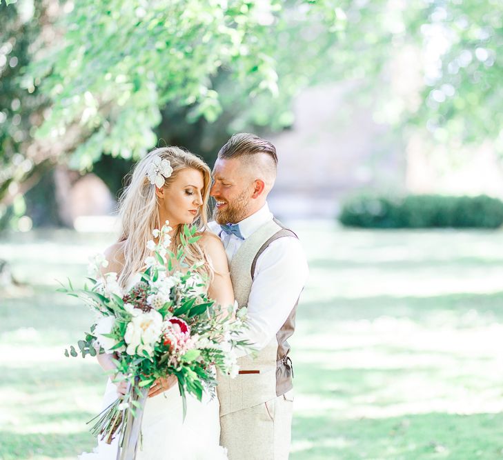 Bride in Pronovias Wedding Dress | Groom in Cream Herringbone Tweed Suit from Marc Darcy | White Stag Wedding Photography