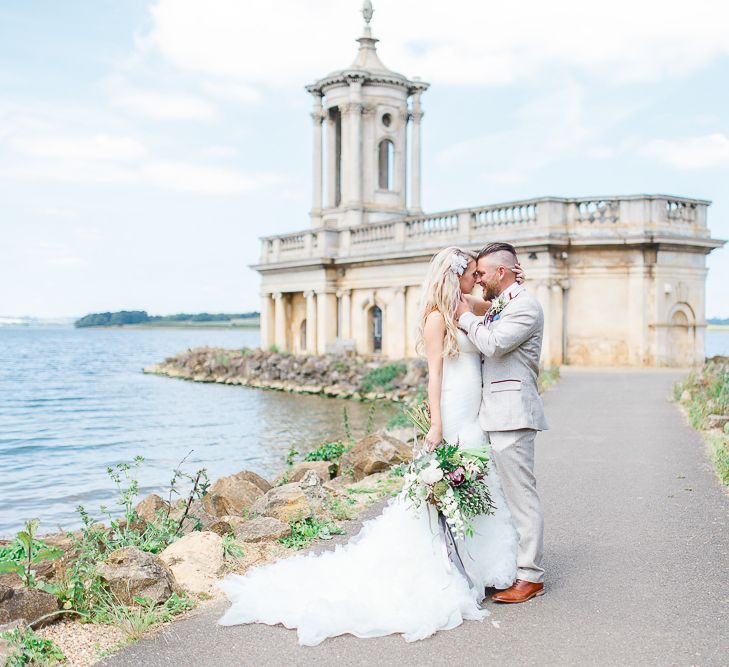 Wedding Ceremony at Normanton Church on Rutland Water | Bride in Pronovias Wedding Dress | Groom in Cream Herringbone Tweed Suit from Marc Darcy | White Stag Wedding Photography