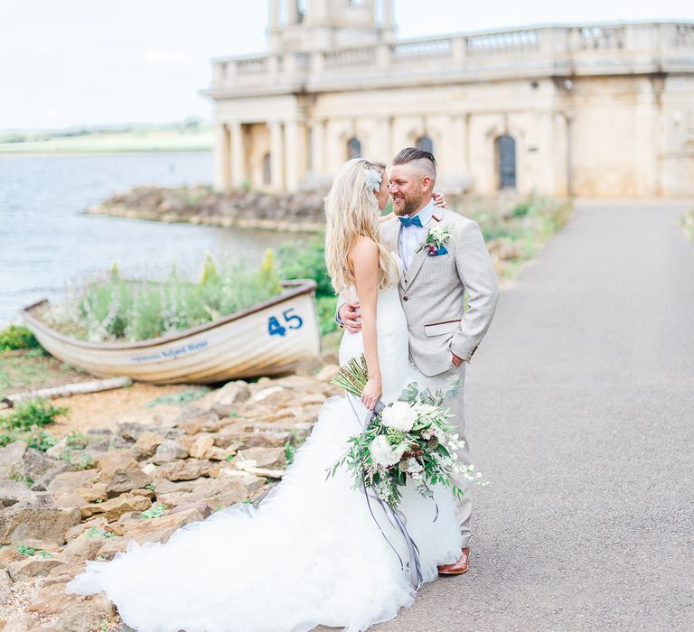 Bride in Pronovias Wedding Dress | Groom in Cream Herringbone Tweed Suit from Marc Darcy | Normanton Church on Rutland Water | White Stag Wedding Photography